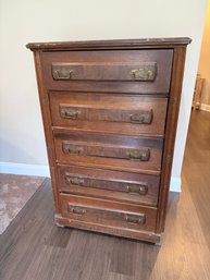 A Vintage Wooden Dresser With Five Drawers And Brass Pull Handles
