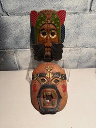 Wooden Tribal-style Mask With Painted Details And Green Fangs & Carved Wooden Thai Mask Depicting An Old Man