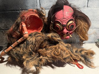 Theatrical Mask With Exaggerated Features And Abundant Hair
