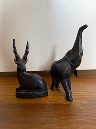 A Pair Of Carved Dark Wood African Elephant And Gazelle Figurines