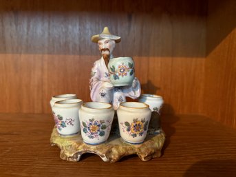 Decorative Porcelain Set Of An Asian Man With Six Floral-painted Cups