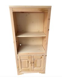 A Rustic Unfinished Pine Wood Hutch Cabinet With Open Shelves And Doors.