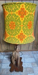 A 1970s Table Lamp With A Retro Floral Lampshade And A Sculpted Wood Base