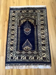 Decorative Prayer Rug With A Mihrab Design And Geometric Borders