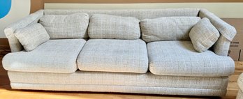 3-seater Upholstered Sofa With Geometric Pattern And Bolster Pillows.