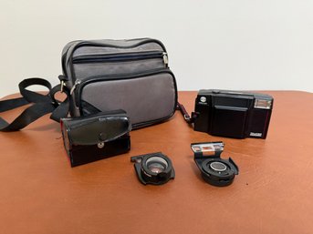 Minolta AF-Sv Talker And Two Auxiliary Telephoto/wide-angle Lenses For A Minolta Talker Camera.