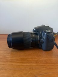 Nikon D80 Camera With A Nikon AF Nikkor 70-300mm Lens.