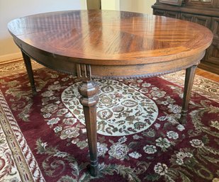 Oval Parquet Top Dining Table With Carved Legs And Beaded Apron