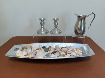 Decorative Set Featuring A Modern Metal Tray Filled With Mixed Seashells, Accompanied By Matching Pewter Candl