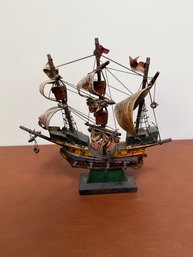 A Wooden Model Of The Mayflower Ship With Fabric Sails And Rigging