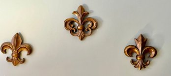 A Modern Decorative Wall Accent In The Shape Of A Fleur-de-lis
