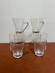 Set Of Four Bormioli Rocco Glass Espresso/cappuccino Cups With Stainless Steel Handles.