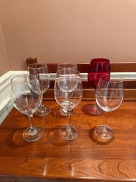5 Clear Glass And 1 Red Glass Wine Glasses