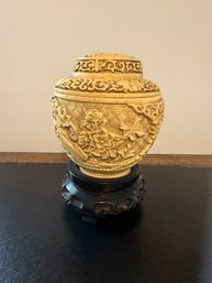 Hand-carved Ivory-colored Lidded Vase With Floral Motifs.