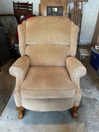 Upholstered Recliner Chair With Carved Wooden Feet.