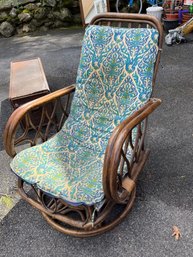 Vintage Rattan Rocking Chair With A Patterned Cushion
