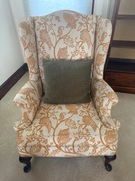 Traditional Wingback Armchair With Floral Patterned Upholstery.