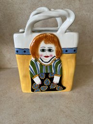 Susan Paley Ceramic Purse Vase By Ganz Featuring A Stylized Woman