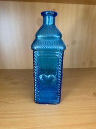Blue Glass Berring's Apple Bitters Bottle With Embossed Apple Design