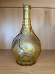 Amber Glass 'Ball And Claw Bitters' Bottle With Embossed Lettering