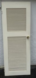 Cream-painted, Two-panel Louvered Interior Door With Brass Hardware