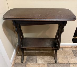 Antique Dark Wood Harp Parlor Table With Lower Shelf And Paw Feet.