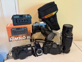 Variety Of Cameras: Nimslo, Nikon, Konica, And More