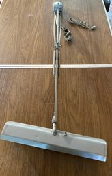 Vintage Gray Articulating Desk Lamp Featuring A Fluorescent Bulb Housing And A Clamp-on Base
