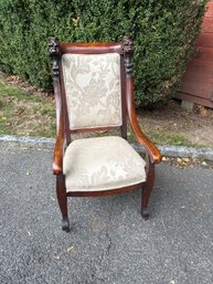 Victorian Or Renaissance Revival Style Chair With Carved Details And Floral Upholstery.