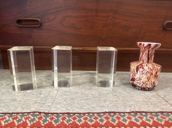 3 Lucite Bookends, And A Hand-blown Art Glass Vase With Swirling Amber, White, And Red Patterns