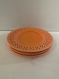 Handmade Orange Ceramic Plates With A Decorative Pierced Rim.