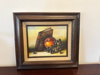 Oil Painting Of A Still Life With A Book, Apple, And Grapes