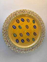Hand-painted Ceramic Plate With Colorful Oval Motifs And Floral Border.