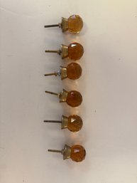 Set Of Three Faceted Amber Glass Decorative Knobs With Brass-toned Bases