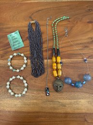 African Tribal Mask Pendant Necklace Yellow Barrel Beads, Modernist Inlaid Sterling Pendent Necklace & More