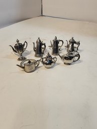 #115  8 Teapot Napkin Rings