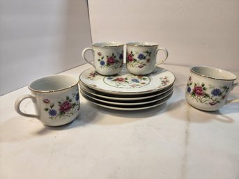 #125 SET OF PLATES AND TEACUPS ALL MATCHING AND PRETTY