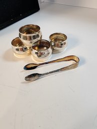 #44s  4 Silver Plate Napkins And Sugar Tongs