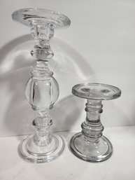 #60 2 GLASS CANDLESTICKS, CLEAR AND SMOKE