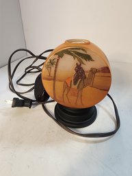 #110  SMALL VINTAGE HAND PAINTED EASTERN DESSERT GLOW LAMP.