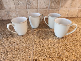 #83 SET OF 4 CREAM COLORED DENBY OF ENGLAND COFFEE MUGS