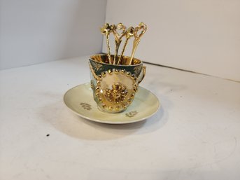 #56  Beautiful Teacup And 4 Gold Teaspoons.  All Pretty.  Saucer Has A Crack In It