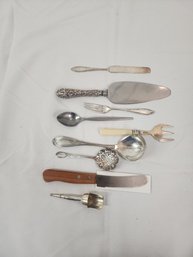 #120 ASSORTED ANTIQUE AND VINTAGE SERVING UTENSILS