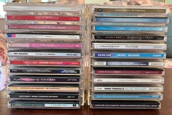 Assorted CDs With Plastic CD Storage Holders - 24 CDs Total