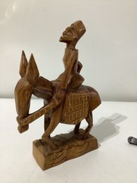 Wood Carving Of Man On Donkey