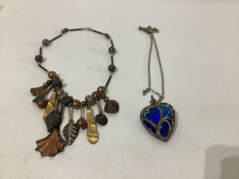 Dark Blue Glass Heart Pendant And The Other An Artisan-style Choker With Mixed Metal And Beads