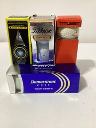 4 Packages Of  A Collection Of Golf Balls From Brands Titleist And Bridgestone