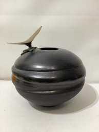 Black Ceramic Vessel Featuring A Sculptured Bird  On Its Rim Signed Illegibly