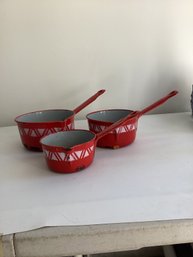 Three Vintage Red And White Enameled Metal Saucepans