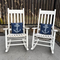 Pair Of White Rocking Chairs With Nautical Pillows - Classic Porch Rockers